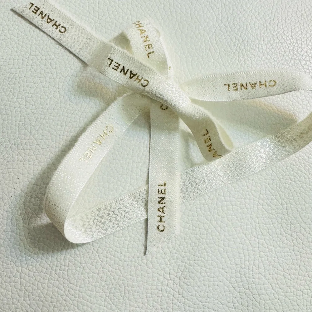 Chanel White Ribbon w gold font limited edition for holiday